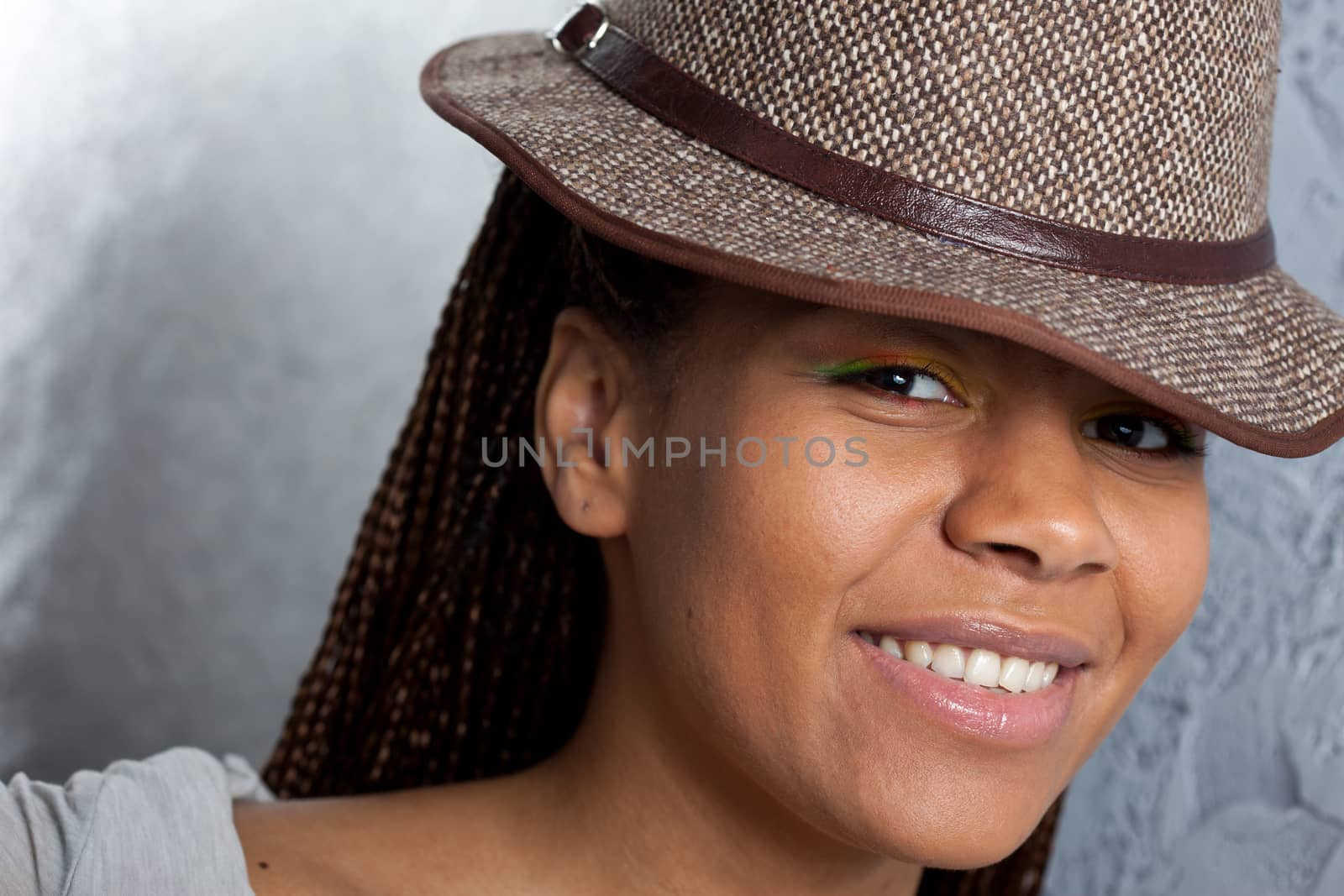 smiling black girl in a hat