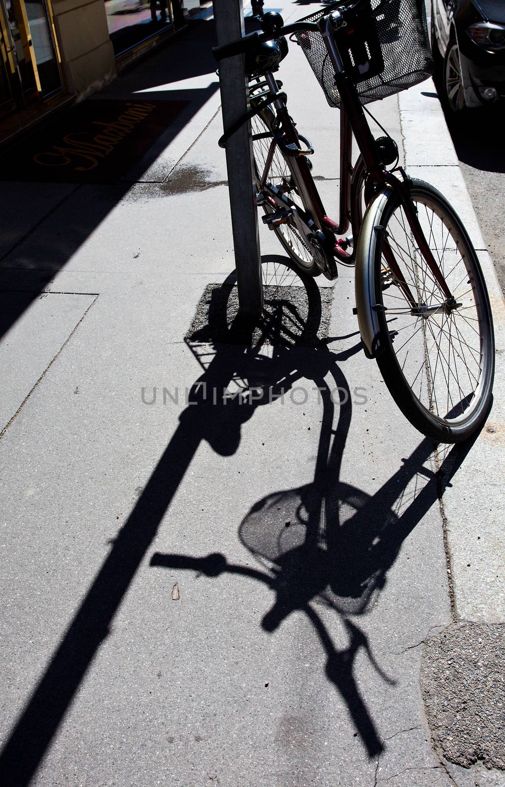 silhouette of a bike and its shadow on the streets of European cities