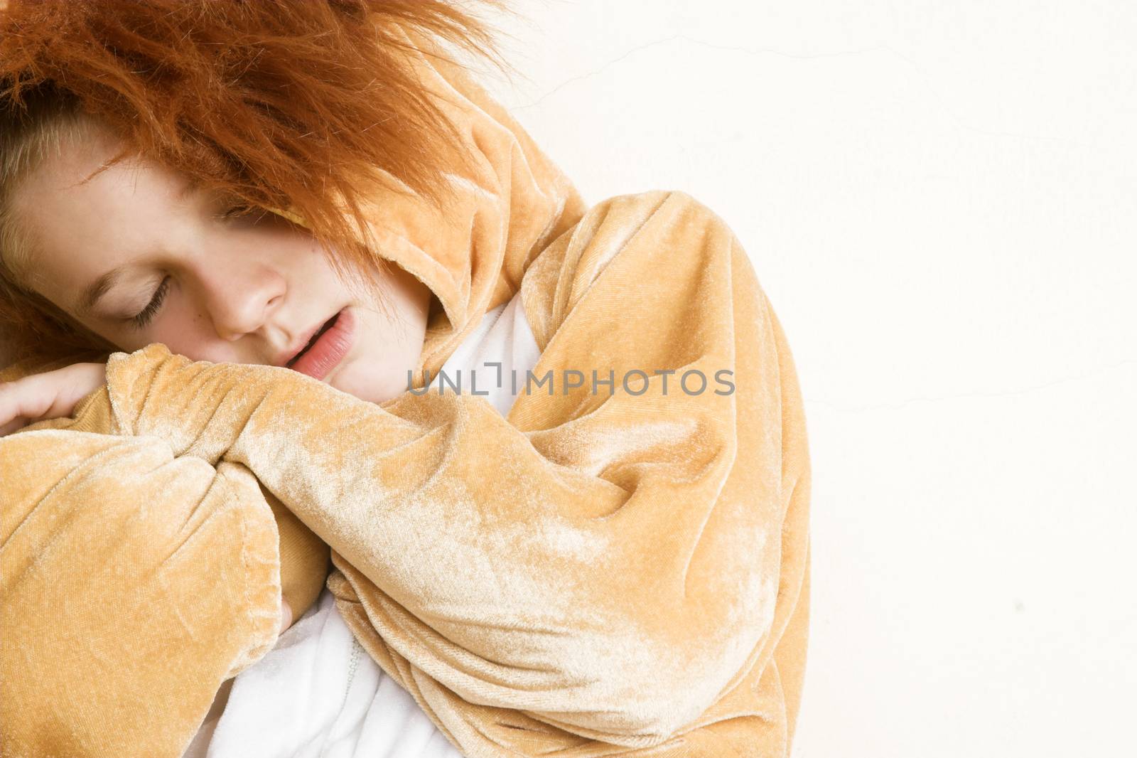 Playful young boy wearing a lion costume