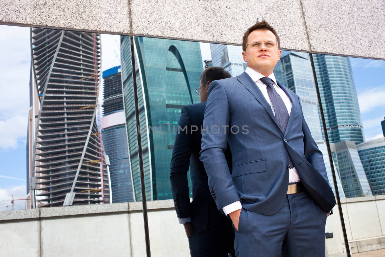 successful businessman  on the background of office buildings