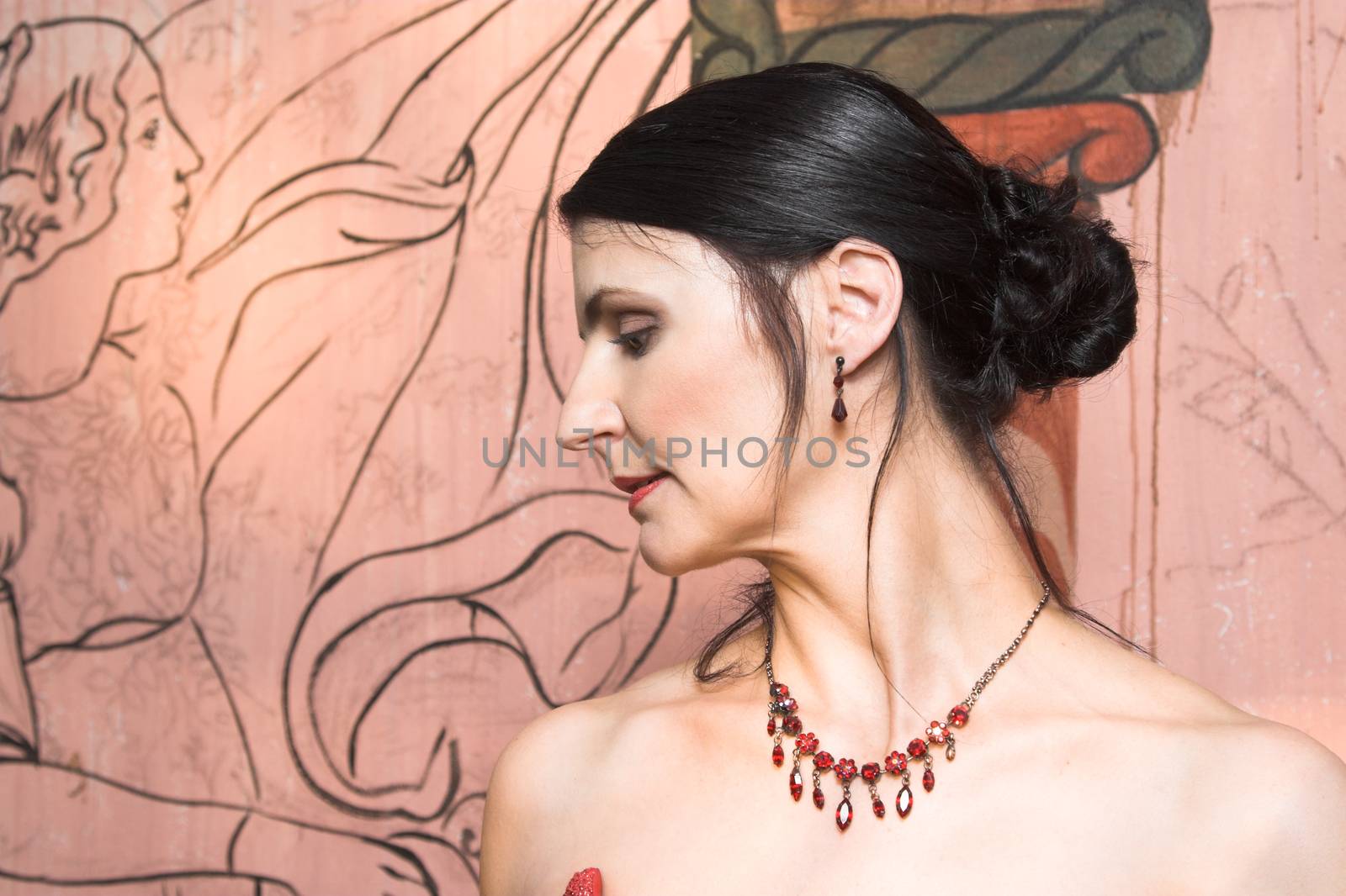 Beautiful Brunette bride with red beaded necklace