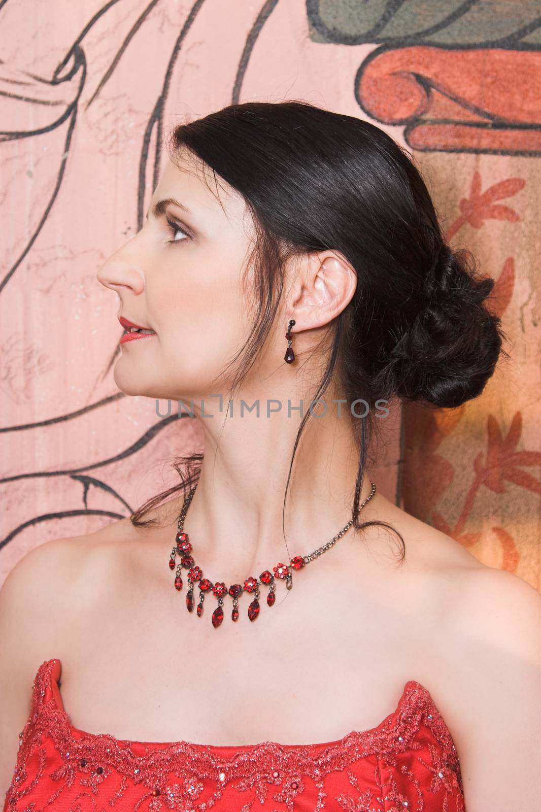 Beautiful Brunette bride with a red beaded necklace