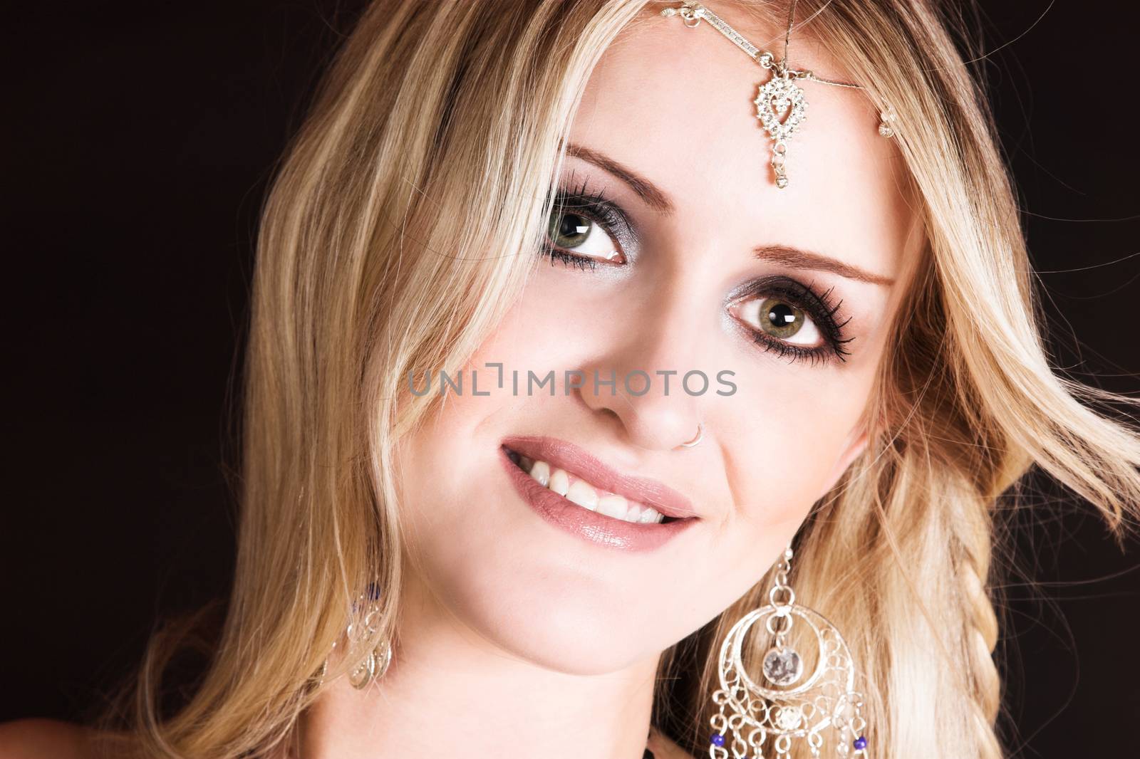 Beautiful Blond Belly Dancer with traditional jewelery