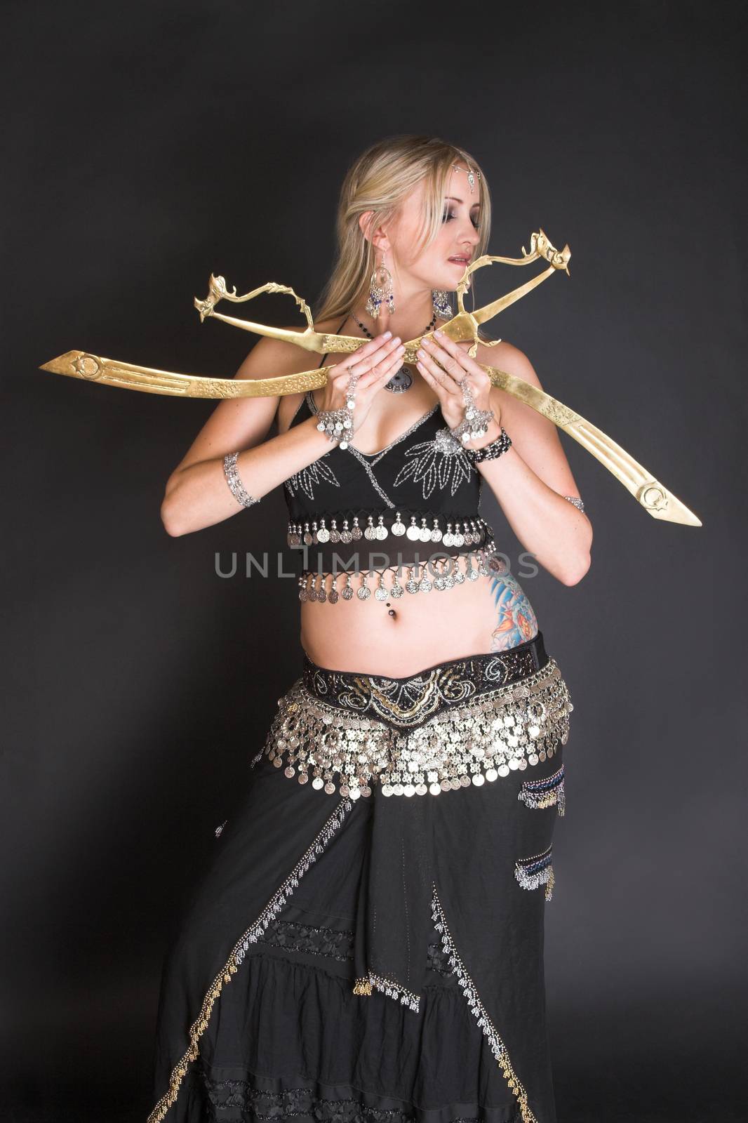 Belly Dancer hands holding traditional tribal swords