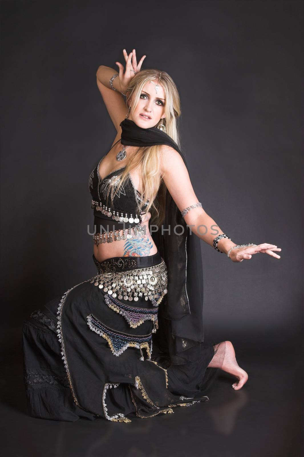 Blond Belly Dancer in a belly dance position