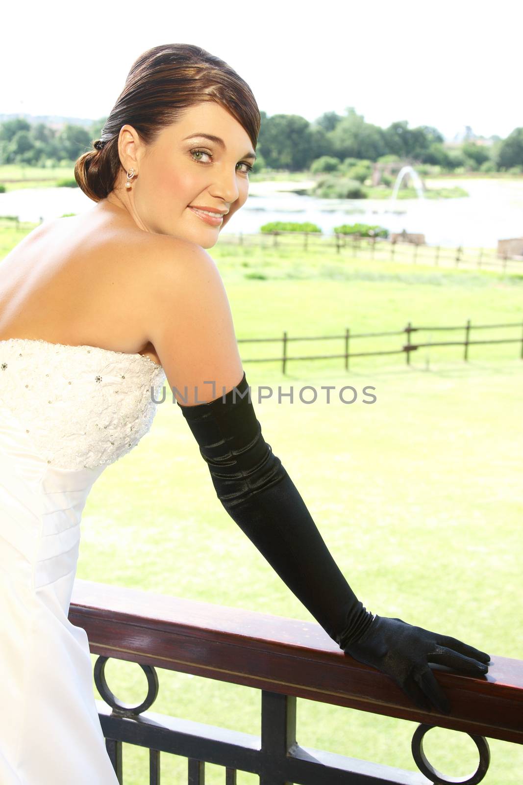 Beautiful Bride in a white dress with fancy gloves