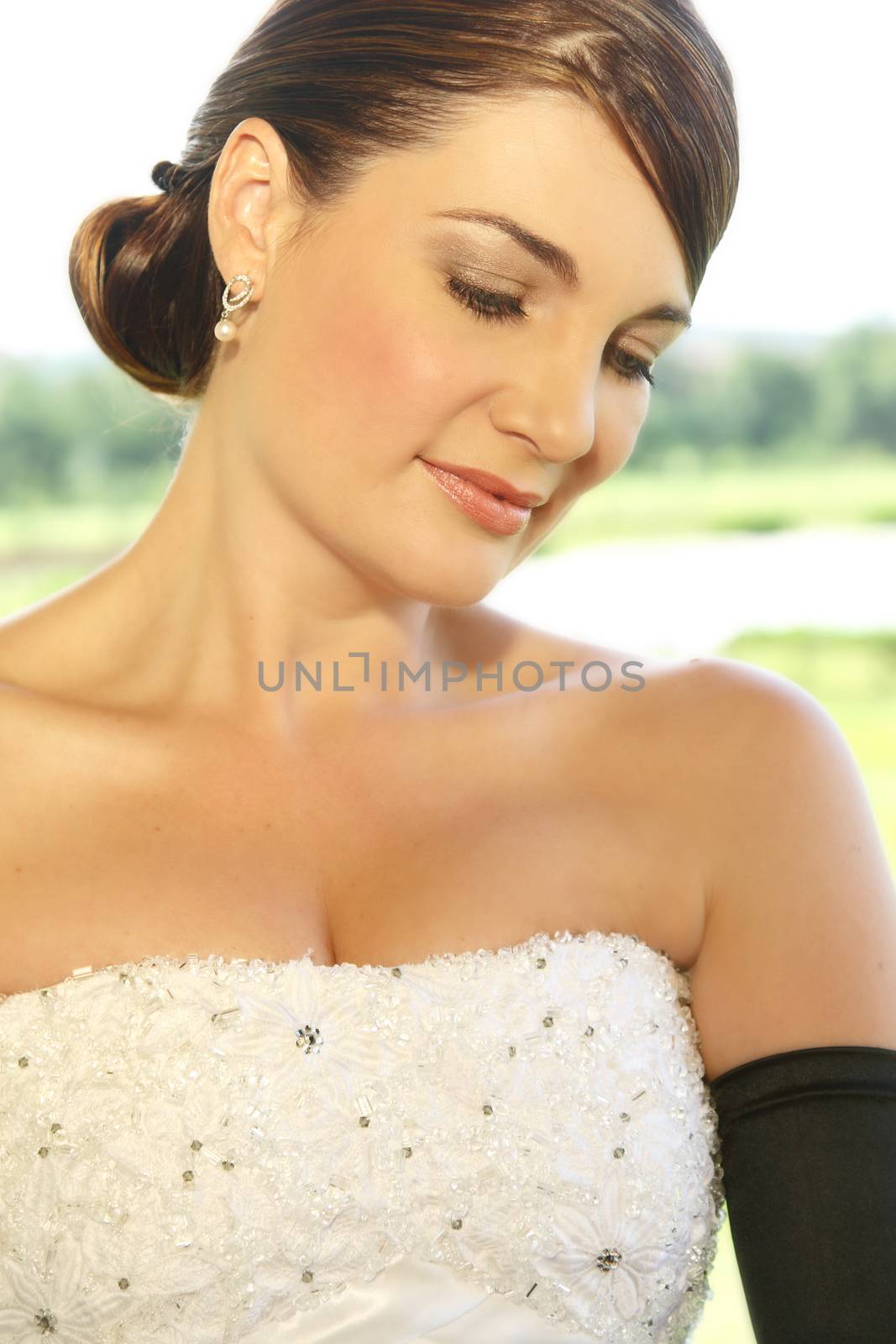Beautiful bride looking away in a shy manner