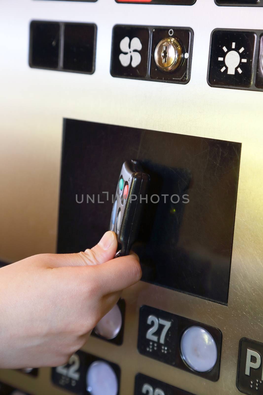 Tapping key tag on elevator