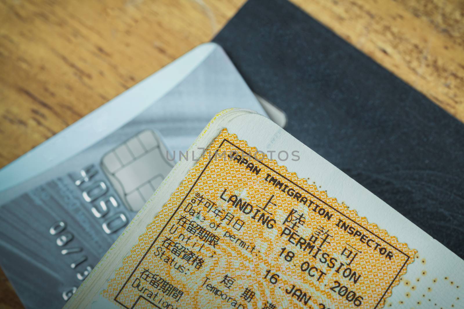 Passport stamp visa of Japan and credit card for travel concept