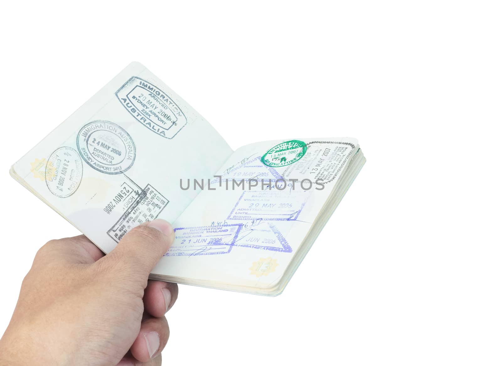 Passport stamp and hand on white background