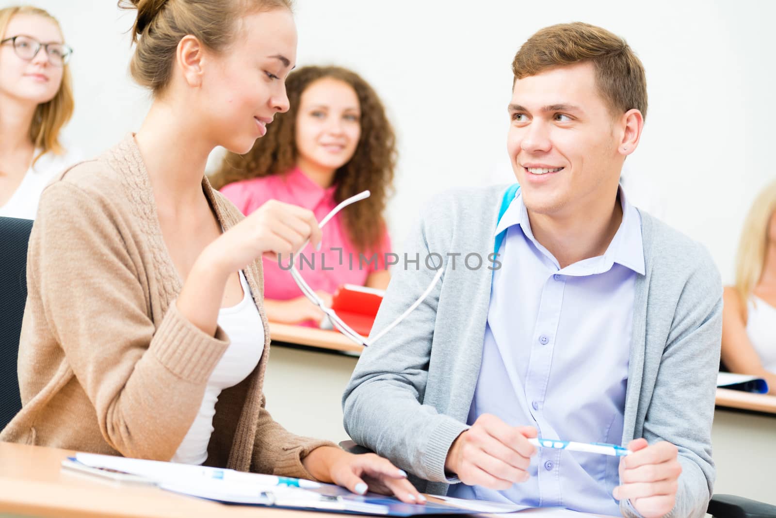 image of a two students in the class talk