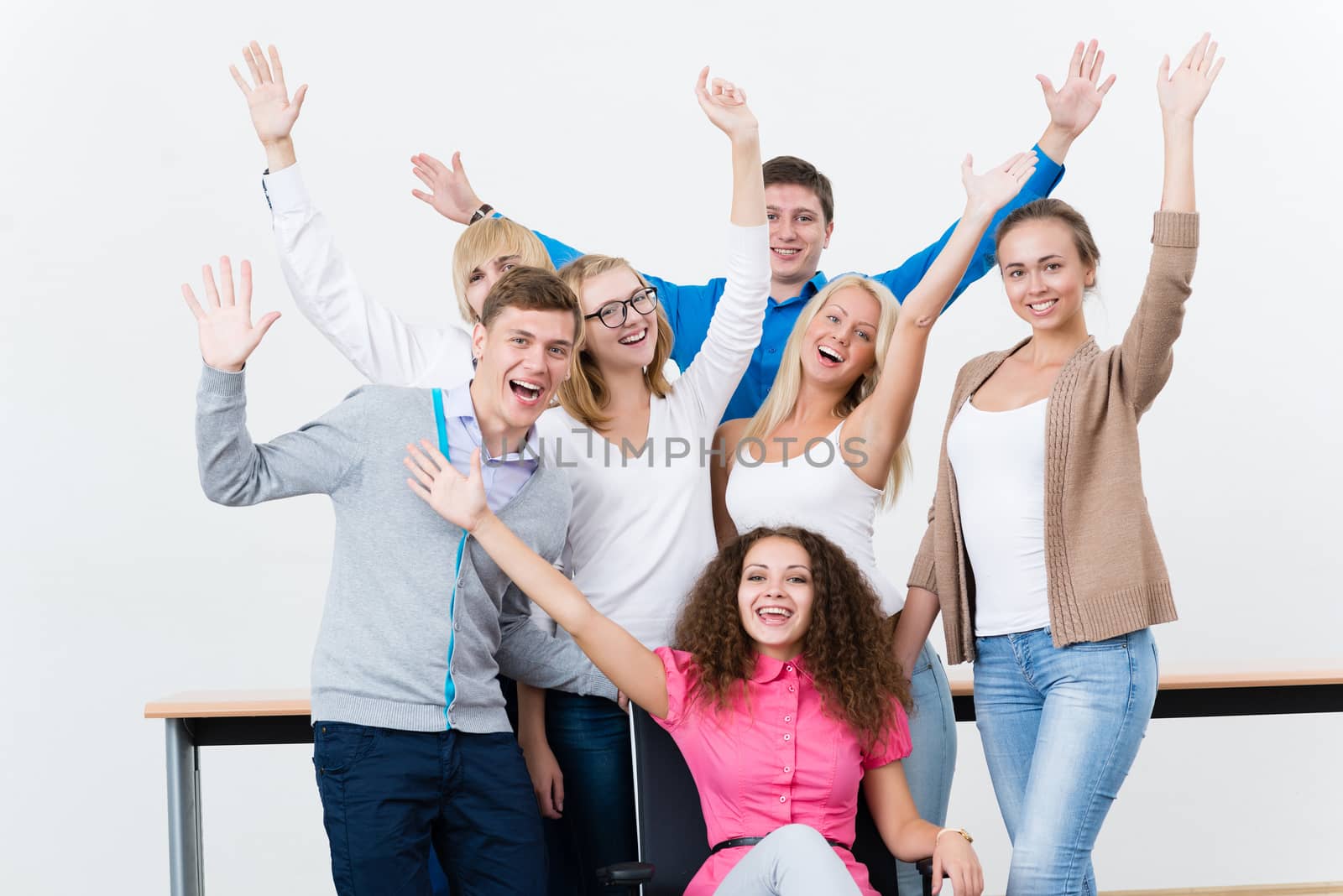 University students in the class raised their hands and having fun