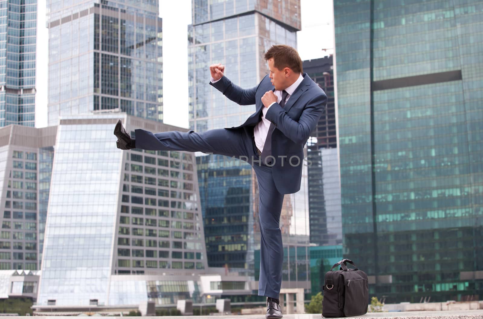 businessman strikes, combative training before the office