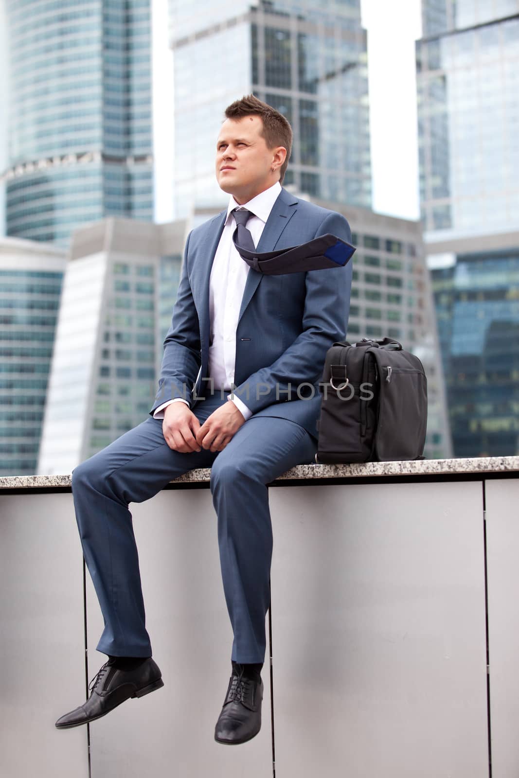 businessman relaxed on the background of the business center