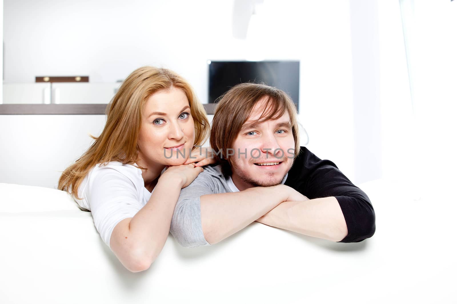 happy couple in the interior of a new home