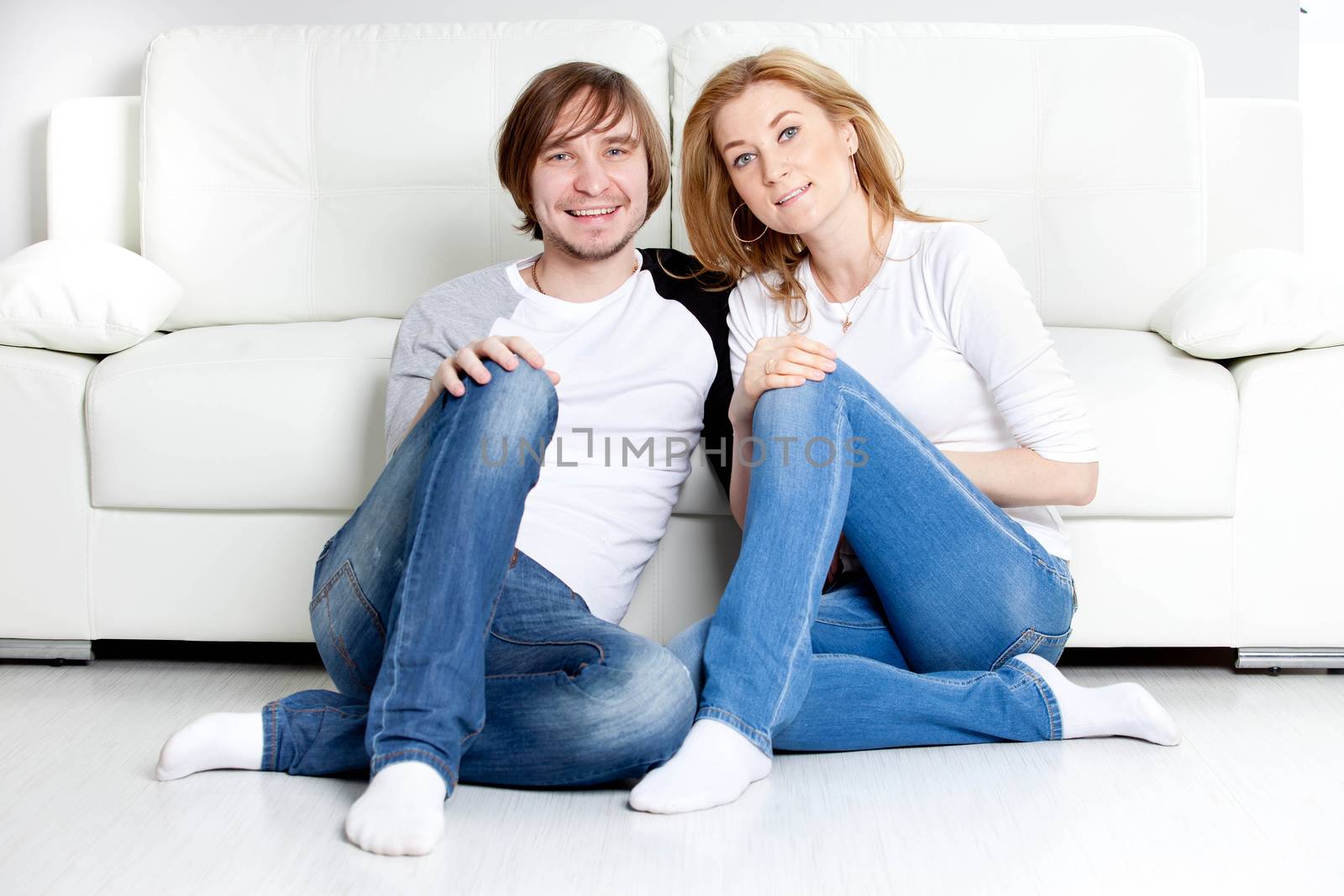 Happy couple relaxing in home