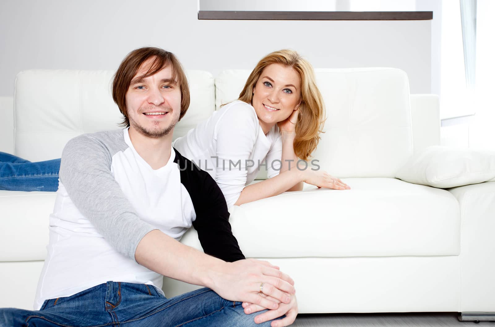 Happy couple relaxing in living room