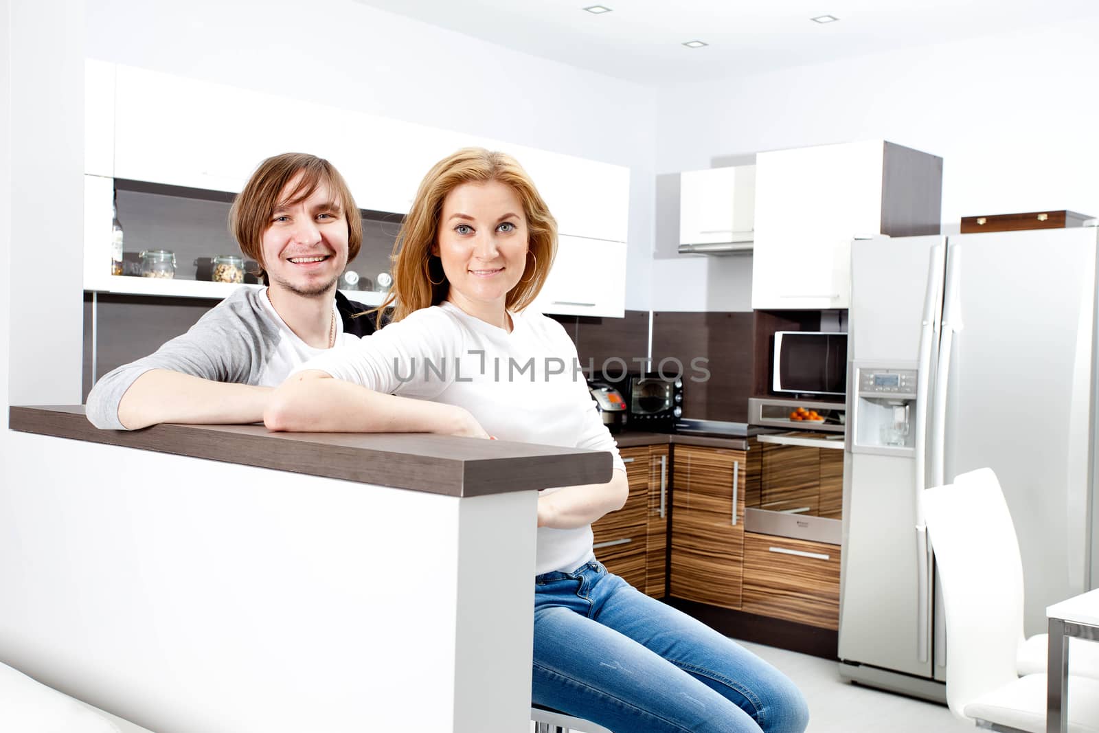 Smiling Couple  In New Home by Astroid