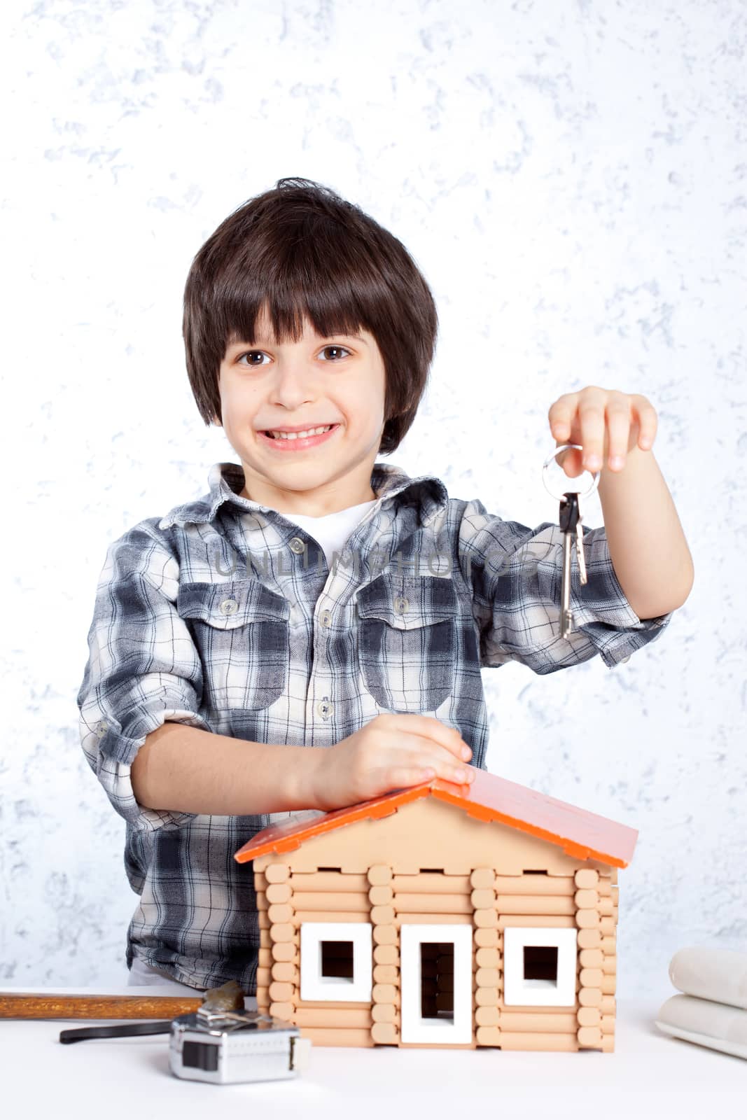 Boy offers the keys to a new home