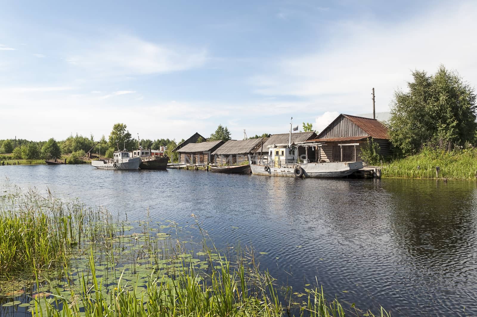 Old fishing boats in the village Maeksa, Belozyorsk, North Russia