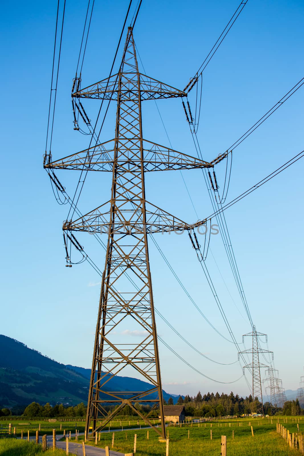 The powerlines with the blue clear sky