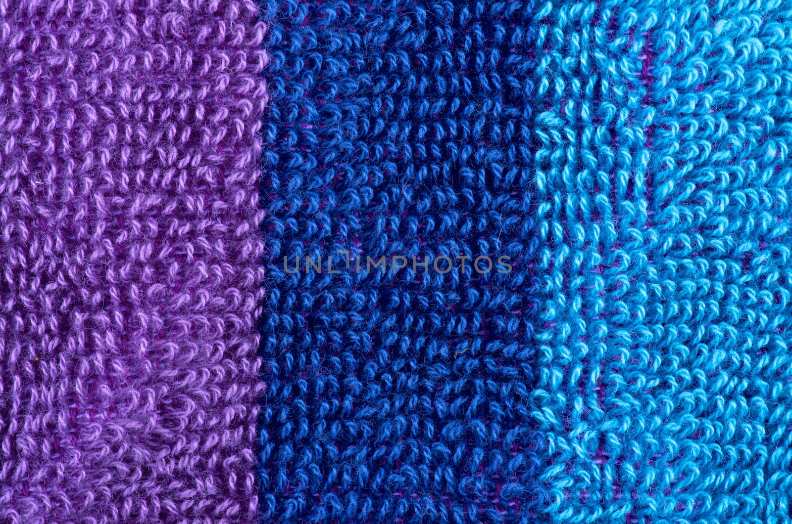 Background of Purple, Navy Blue and Blue Fluffy Cotton Rows closeup