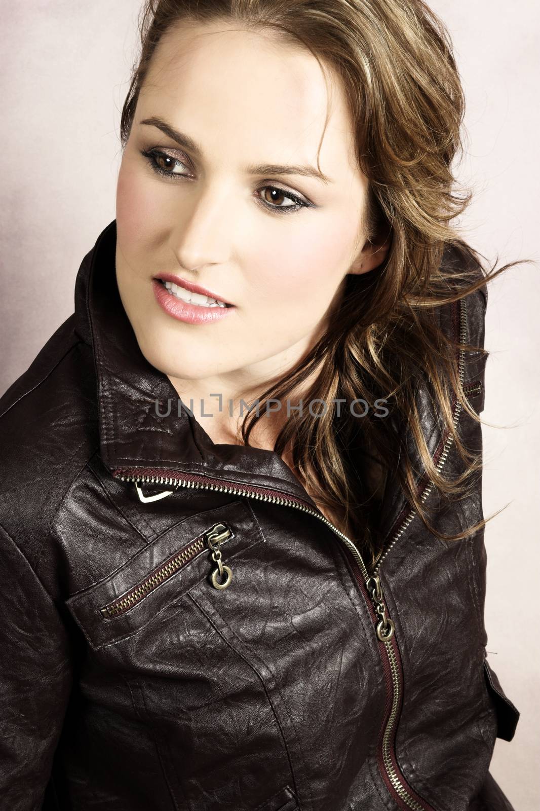Beautiful young female wearing a leather jacket