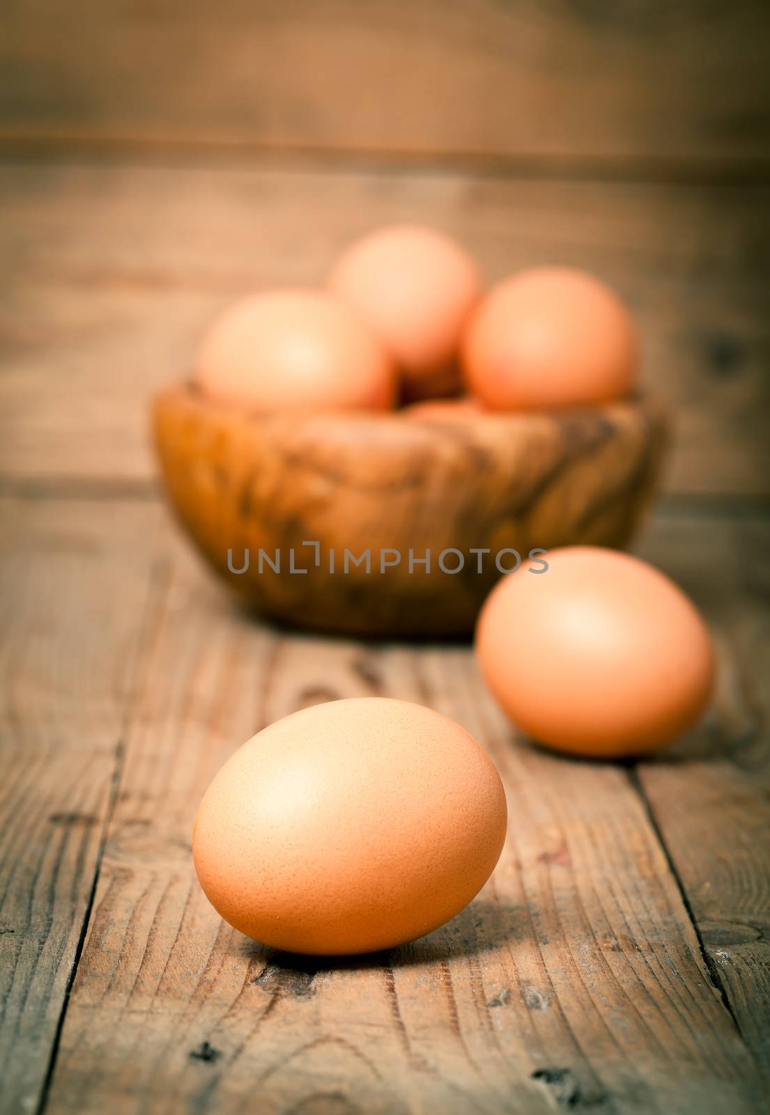 eggs on wooden background by motorolka