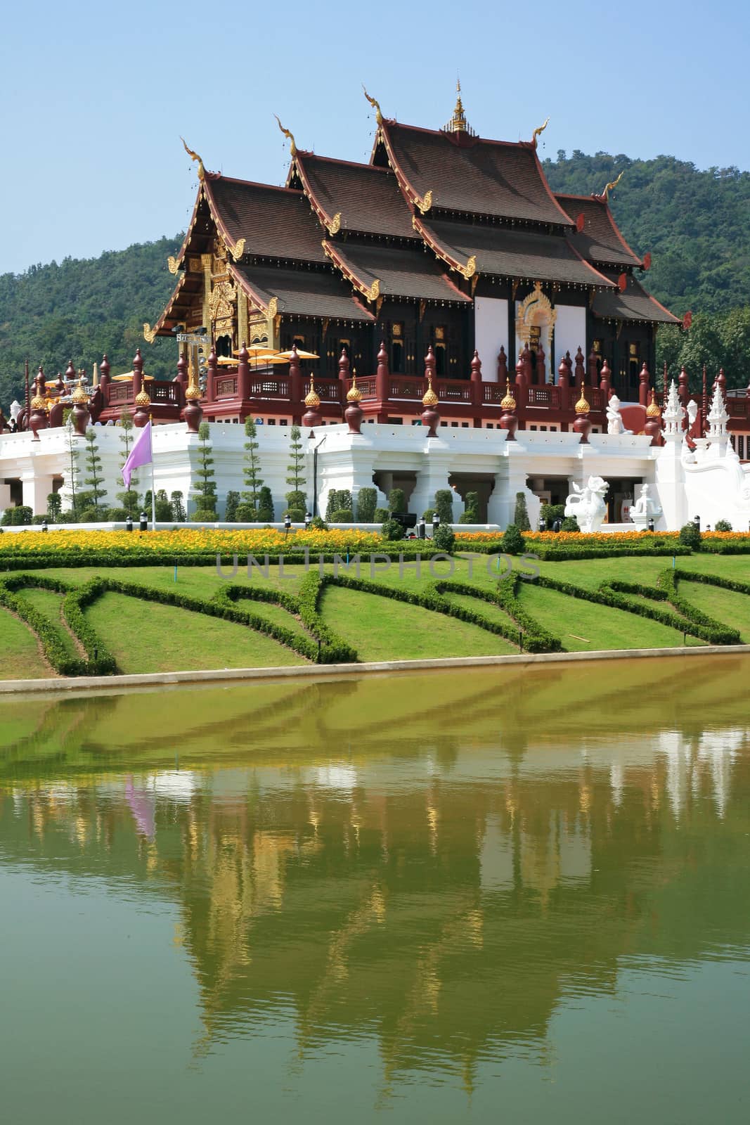 Traditional thai architecture in the Lanna style , Royal Pavilion (Ho Kum Luang) at Royal Flora Expo, Chiang Mai, Thailand