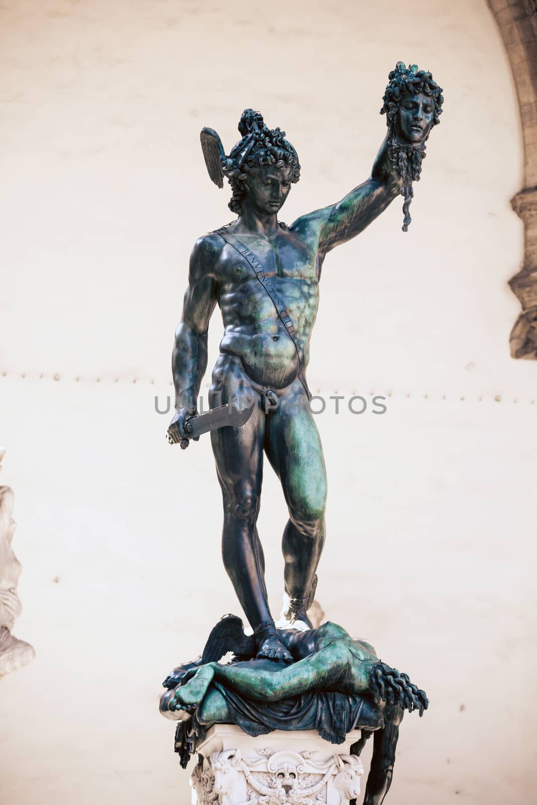 FLORENCE, ITALY - AUGUST 2: Perseus holding head of Medusa, bronze statue by Benvenuto Cellini in Loggia de Lanzi, Piazza della Signoria, Florence, Italy