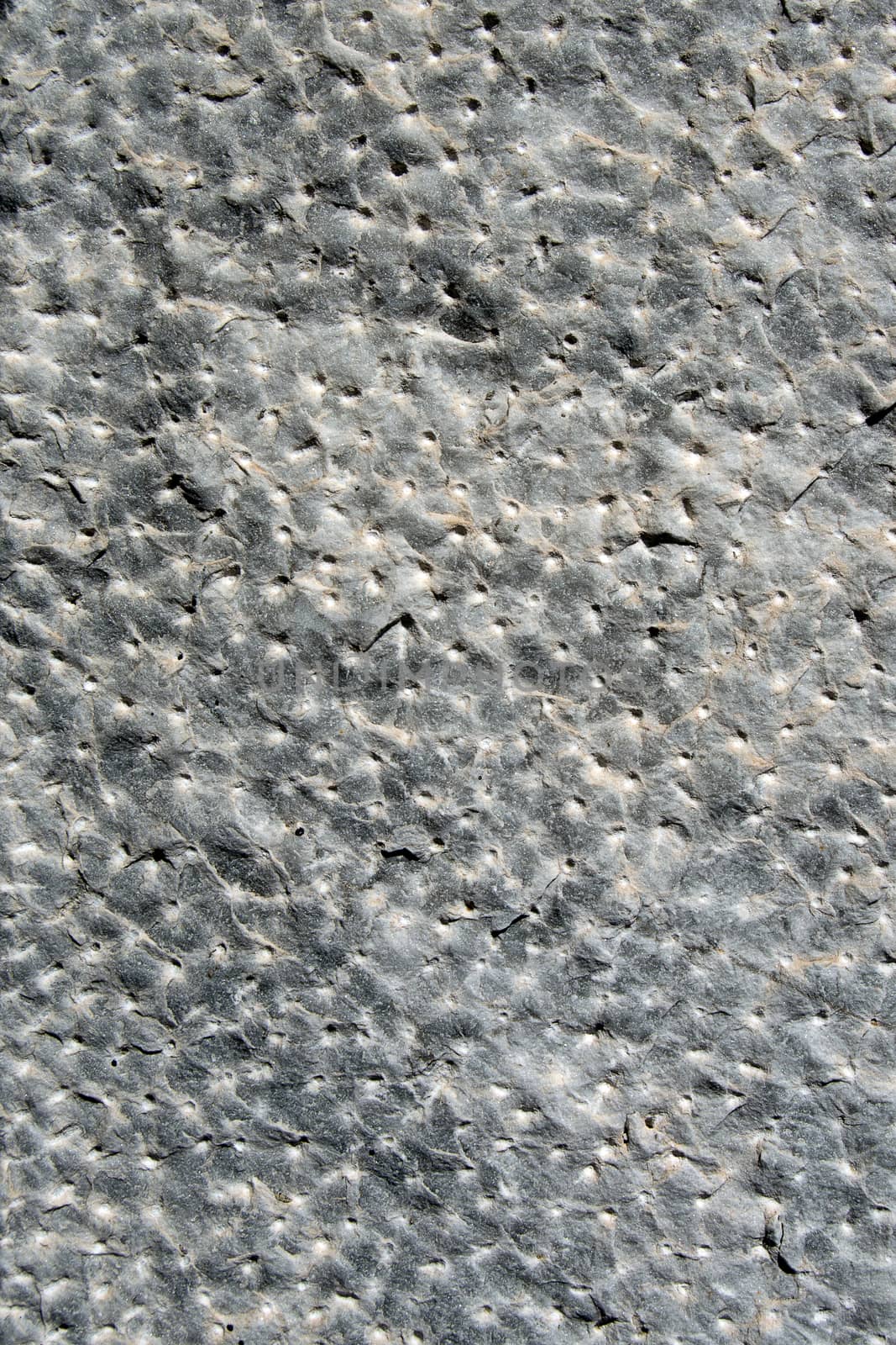 Close up of hand-hammered ancient stone floor (italian castle in La Spezia), gray rock, perfect for a background