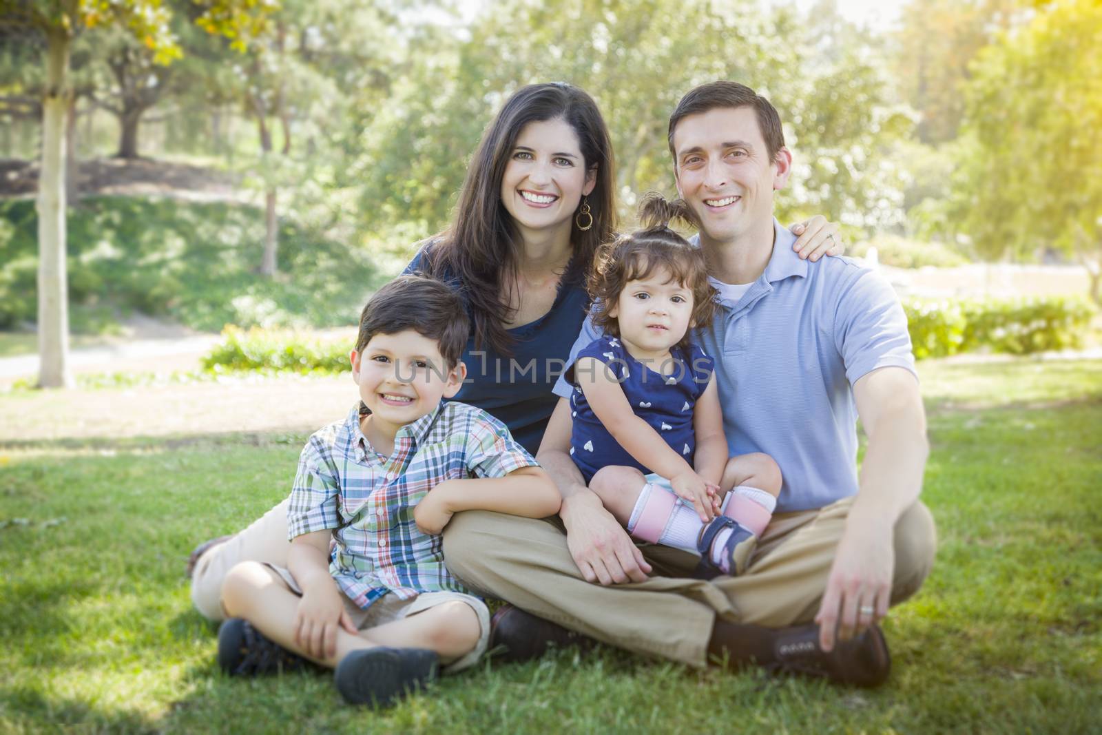 Attractive Young Mixed Race Family Outdoor Portrait in the Park.