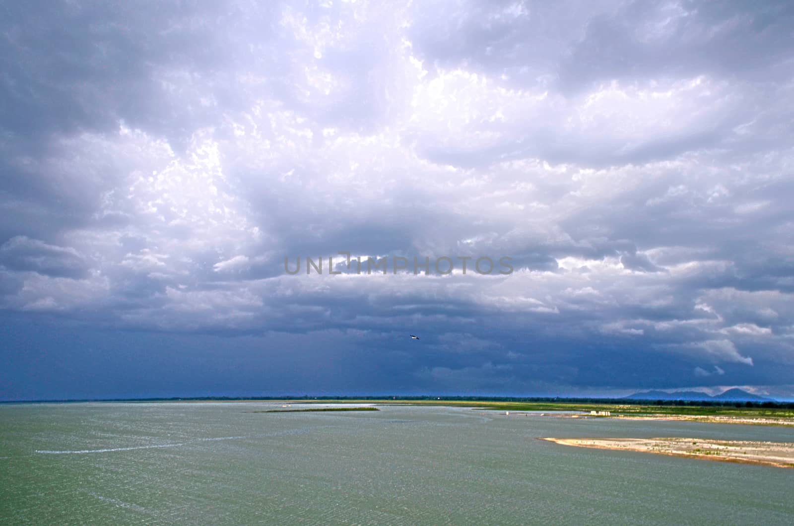 The Lake on Dam with Deep Cloudy  Blue Sky