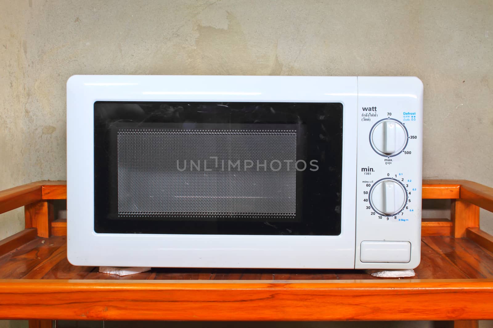 Microwave oven on the table in kitchen