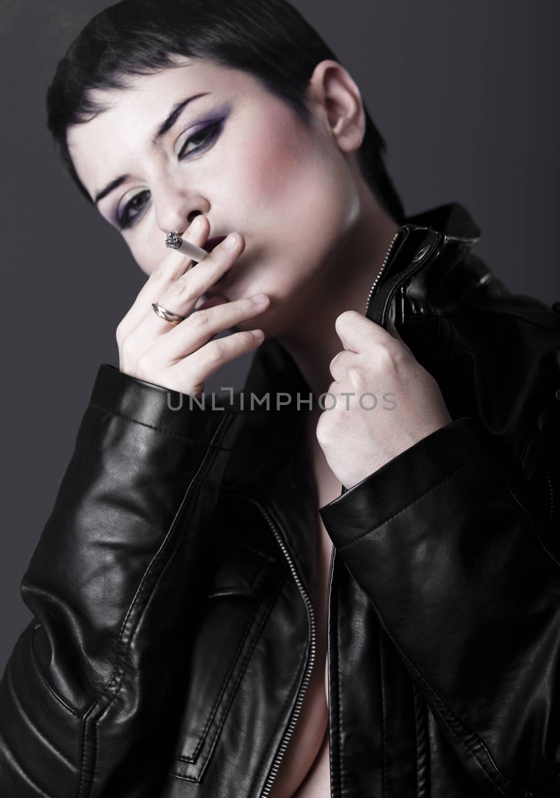 Nude woman with black leather jacket smoking a cigarette by FernandoCortes