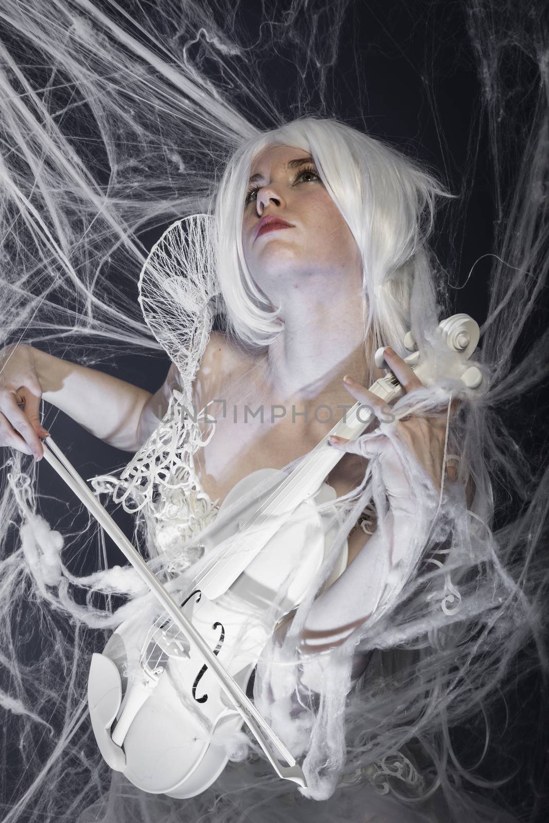 instrument, beautiful woman with couture gown in white, violin, music concept