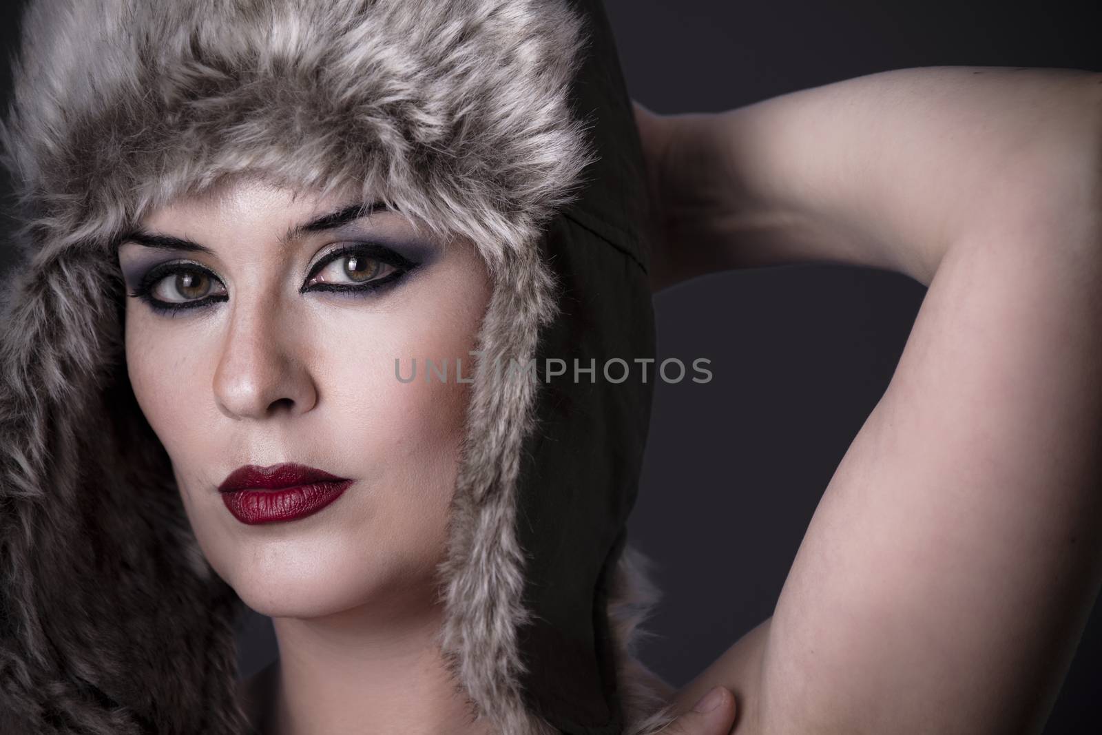 Interesting nude woman with typical Russian fur hat