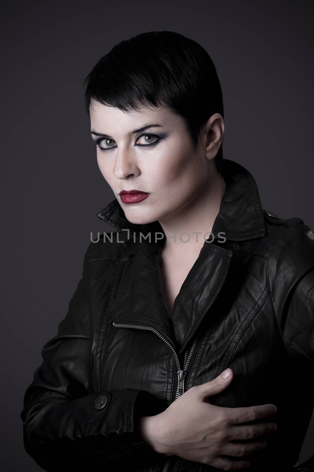 Serious sexy woman with black leather jacket by FernandoCortes