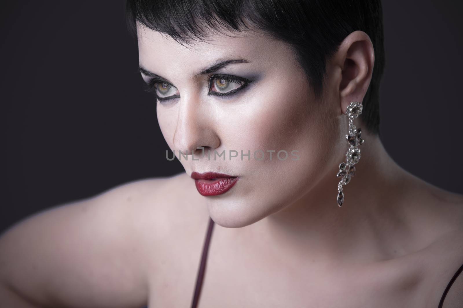 Elegant brunette with beautiful green eyes and silver jewelry by FernandoCortes