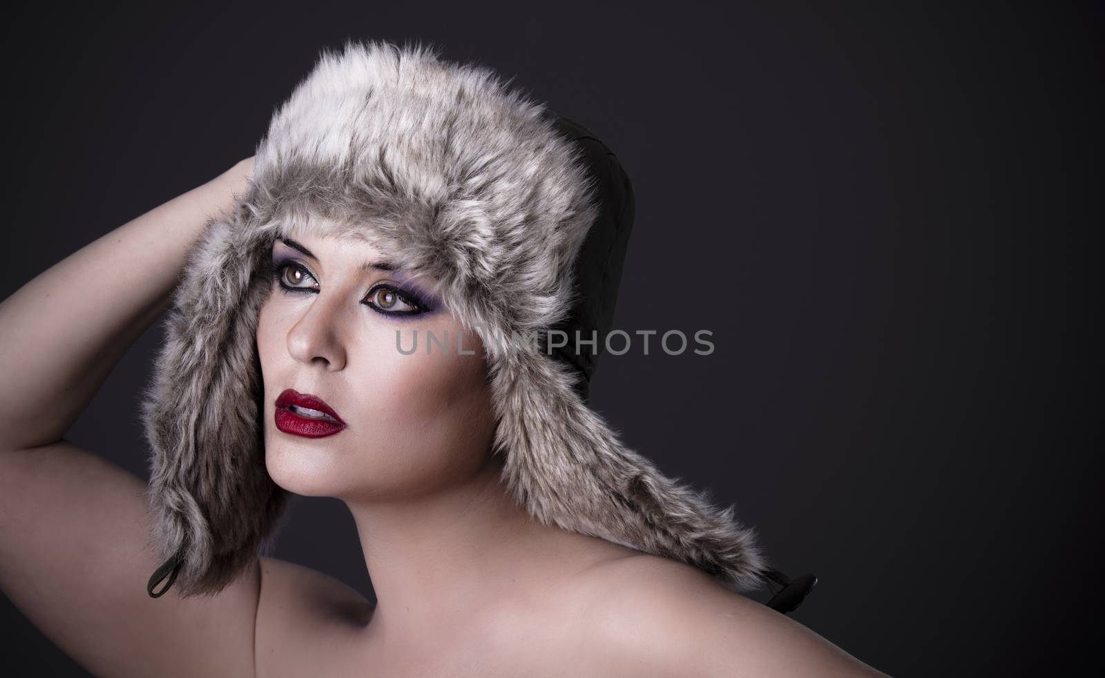 Russian Girl with hat on a dark background