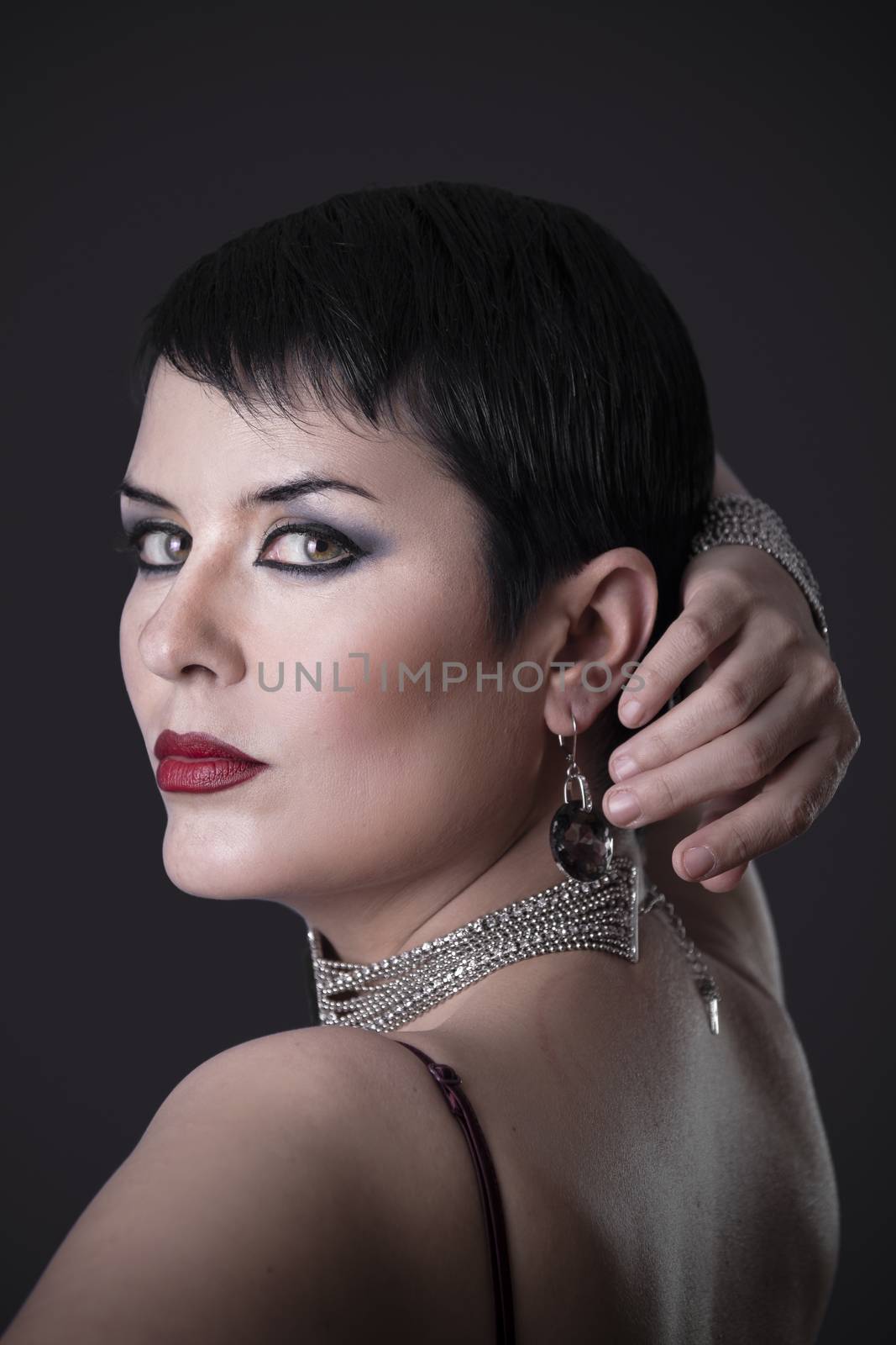 Back elegant brunette woman with jewelry
