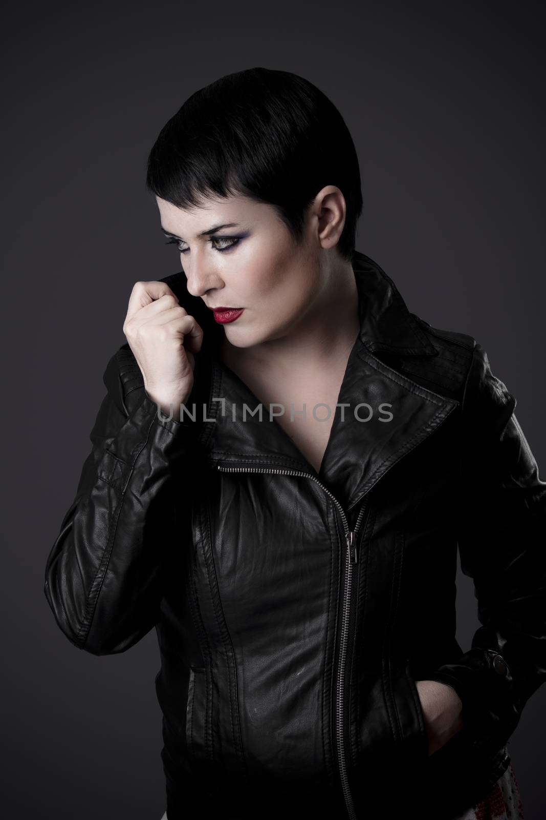 Elegant and sexy woman with tough leather jacket black