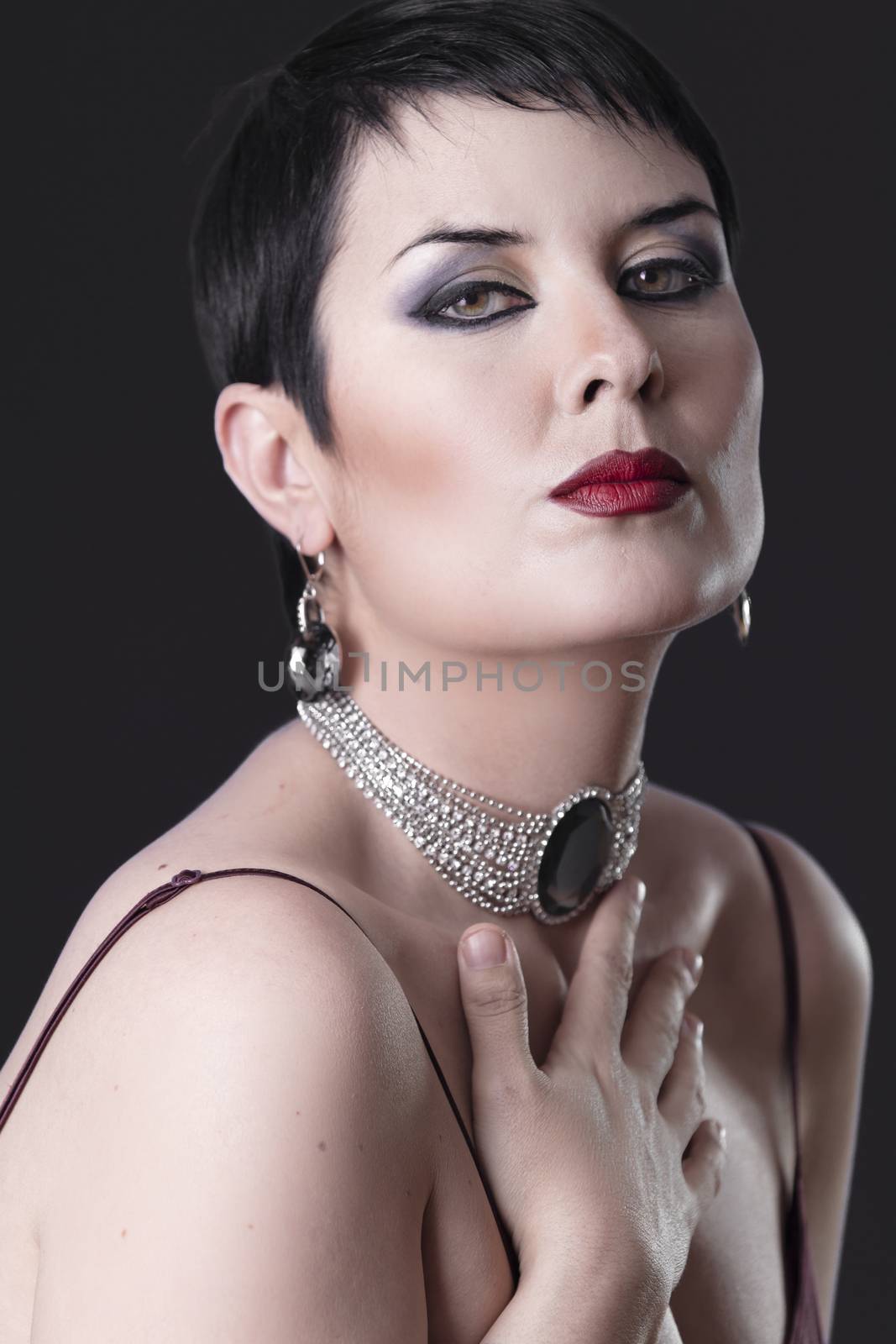 Sexy woman with elegant silver jewelry caressing her breast by FernandoCortes