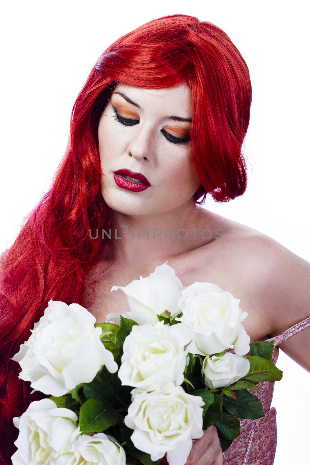 elegant and beautiful woman with red hair holding a bouquet of white roses