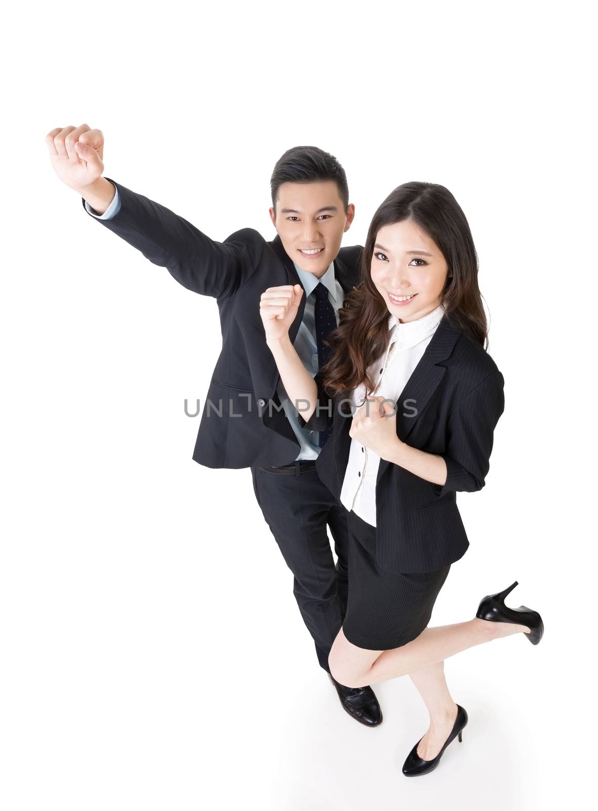 Cheerful business man and woman, full length portrait.