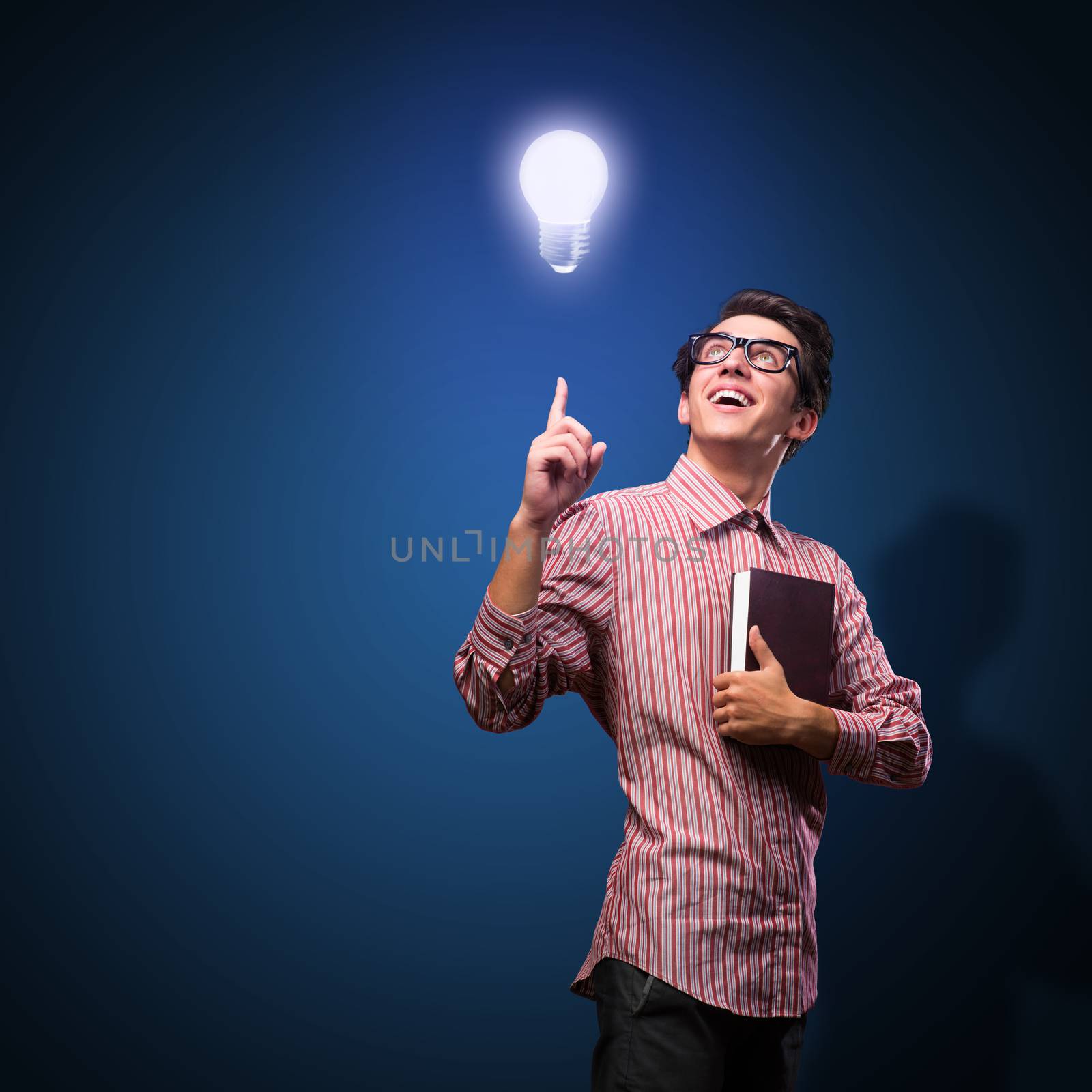 young man holding a book by adam121