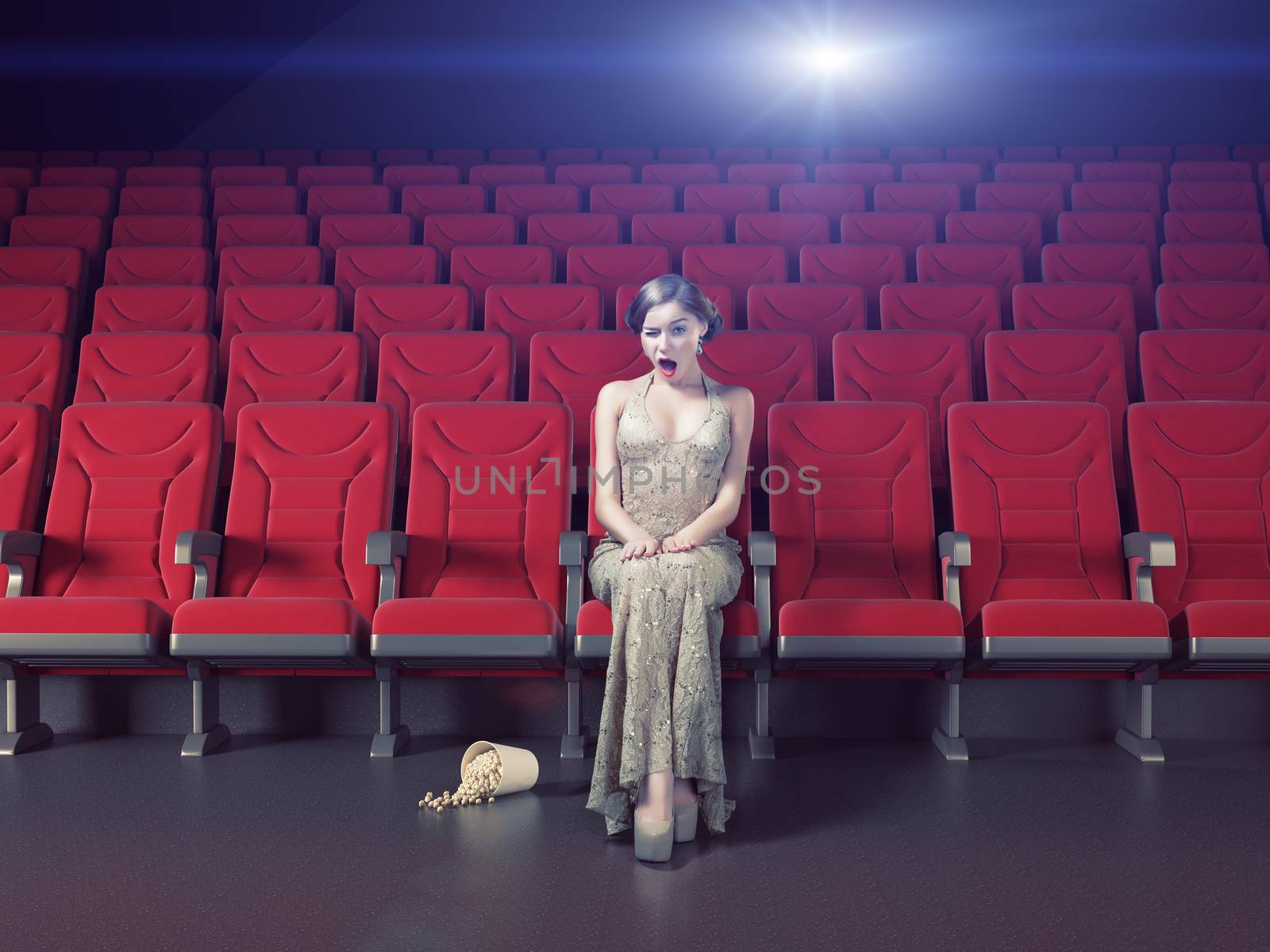 Surprised beautiful girl in an empty cinema. Creative concept