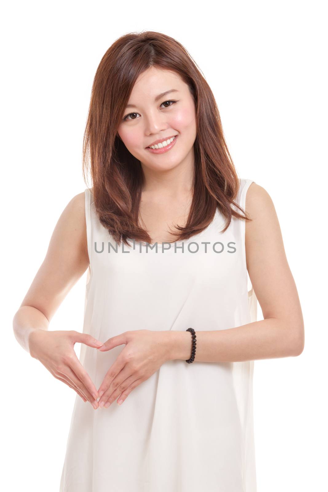 Asian woman holding hands in heart shape