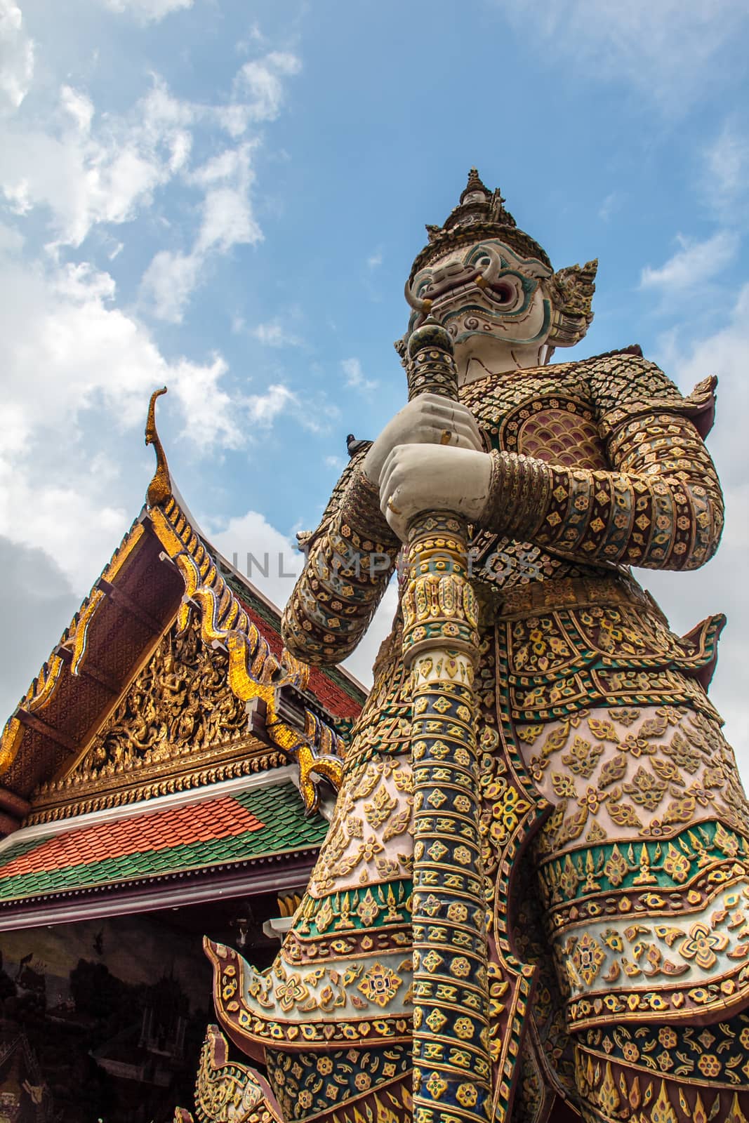 the wat Phra Kaew shelter the most sacred image of Thailand the Emerald Buddha.  View of a giant or yakshas