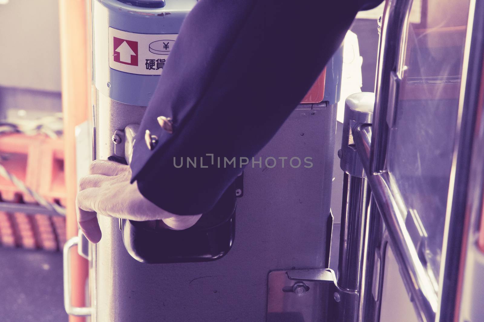 Tokyo, Japan, April 12, 2014 Bus driver pick a bus ticket in the ticket machines,On April 12, 2014 in Tokyo, Japan